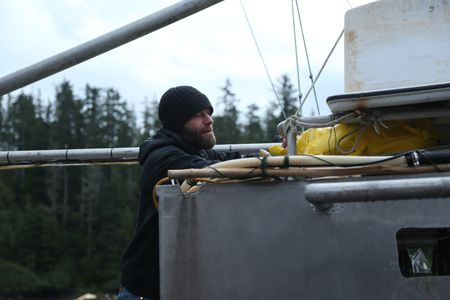 Matt Carlson fishes for salmon near the end of the summer troll season. (National Geographic/Wayne Moss)