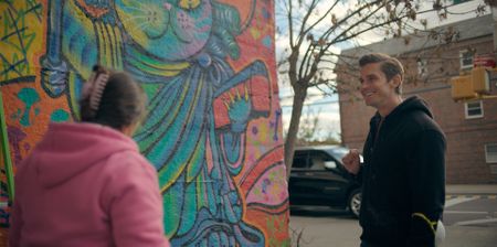 Lady Pink and Antoni Porowski work together on one of her murals. (National Geographic)