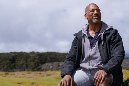 Christian Cooper surveys the Hawaii Island Nēnē Sanctuary. (National Geographic for Disney/Troy Christopher)