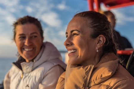 Series Producer, Sarah Beard, aboard a dive vessel in Port Philip Bay with Dr. Alex Schnell.   (National Geographic for Disney/Harriet Spark)