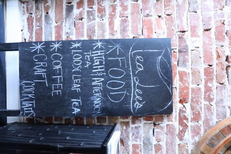 BLACK TRAVEL ACROSS AMERICA - TeaLee's sign shows a vast variety of hot drinks and teas. (National Geographic for Disney/Victoria Donfor)