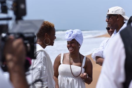 National Geographic Explorer and Storyteller Tara Roberts discusses the complex mix of sorrow, pride, and joy with Clotilda descendants on Ouidah Beach, reflecting on their ancestors' legacy and their emotional journey. (National Geographic/Etinosa Yvonne)