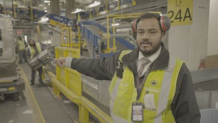 Prem Vaghela, Operations Manager at Air Canada, stands in Toronto Pearson's 18 and a half mile conveyer belt system for luggage. (Arrow International Media Ltd & Cantina Media)