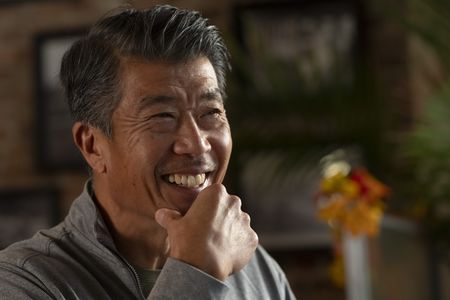 Al Kim, who worked as a paramedic during the 9/11 attacks, smiles as he talks with Kevin Shea. (National Geographic/Virginia Sherwood)