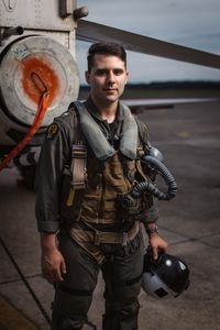 Student LTJG Marcus Figueroa poses behind a T-45. (Credit: National Geographic/Freddie Claire)