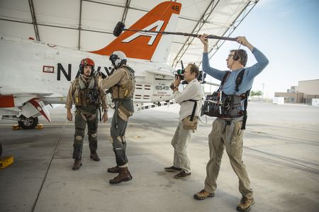 DOP Jon Southgate-Sayers and sound recordist Phil Bax following student 1st LT Austin Clagget and his instructor on the way to their jet. (Credit: National Geographic/Freddie Claire)