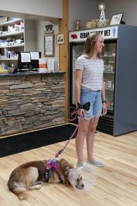 Kim Borchert stands with her dog Diamond after her vulvoplasty procedure has been successfully completed. (National Geographic)