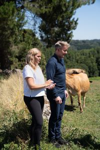 Tilly and Gordon Ramsay look out on a cow pasture in Chantada, Spain. (National Geographic/Justin Mandel)