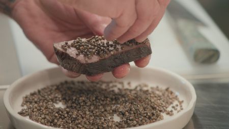 TUCCI IN ITALY - “Sardinia” - Puffed hemp seeds, grown at Agriturismo Casa Marmida is sprinkled on a sous vide flank steak at the farm restaurant. (National Geographic)TUCCI IN ITALY