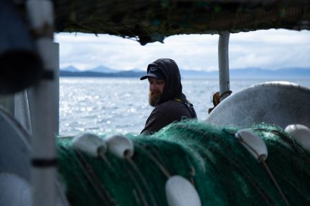 Carl Hernandez fishes for salmon. (National Geographic/Lukas Taylor)