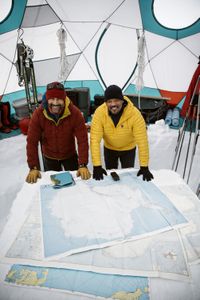 Polar Athlete Richard Parks, left, reviews the path of their journey on maps with Will Smith in Antarctica. (credit: National Geographic/Freddie Claire)