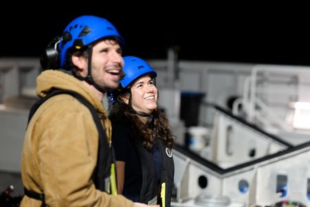 Eric Stackpole and Melissa Marquez on the deck of the OceanXplorer. (National Geographic/Mario Tadinac)