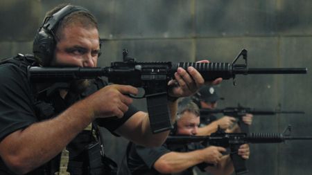 Justin Joubert and Jannie Kleynhans practice shooting as part of their training in Johannesburg, South Africa. (National Geographic)