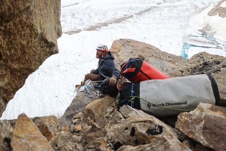 Aldo Kane looks at the route ahead during a break from ascending Pool Wall.  (photo credit: National Geographic/Matt Pycroft)
