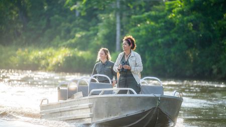 Paula Kahumbu, elephant expert, and Odzala Discovery Camps guide, Kerri Lee, go in search of finding the elusive forest elephants in Odzala National Park, Republic of Congo. The forest is very dense, making waterways the easiest form of travel. (National Geographic for Disney/Sebastian Blach)