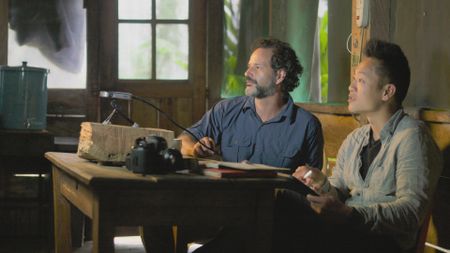 Albert Lin and Santiago Giraldo looking at LiDAR data. (National Geographic)