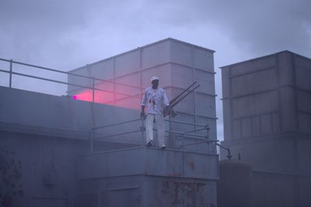 Mess attendant Doris Miller (played by Abdul Sulaiman) uses an anti-aircraft gun on the USS West Virginia in a WW2 historic reenactment scene for "Erased: WW2's Heroes of Color. The series tells the stories of three Black heroes who miraculously survived the attack on Pearl Harbor. One of these men, mess attendant Doris Miller, defied racial stereotypes when he shot down enemy planes during the attack. (National Geographic/Rekha Garton)