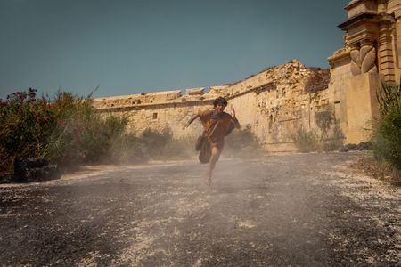 Avianius, played by Frankie Treadaway, flees Pompeii, sprinting through the city gates to escape the pyroclastic flow. (National Geographic/Darrin Zammit Lupi)