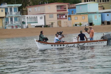 Christian Cooper takes to the sea to meet "Captain Pelican" who has a special bond with the seabirds on the west side of the island. (National Geographic for Disney)