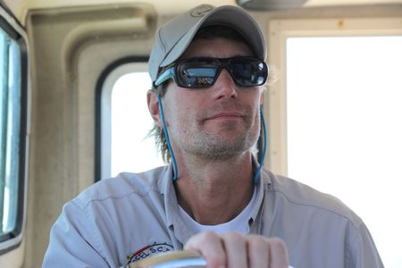 Greg Metzger driving his boat. (National Geographic/Mariana Kneppers)
