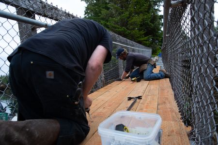 David Squibb and Matt Carlson repair a gangway. (National Geographic/Wes Waters)