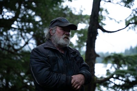 Terry Simpson is grateful for his neighbors' help in building him a new cabin. (National Geographic/Robert Jolley)