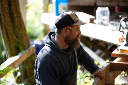 Carl Hernandez helps construct a ramp on his neighbor's property. (National Geographic/Mickey Ramos)