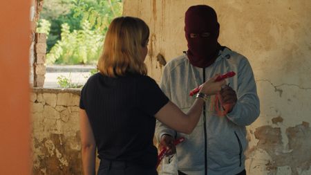Super shows Mariana van Zeller an explosive that he uses to break open the safes in the cash-in-transit trucks in Johannesburg, South Africa. (National Geographic)