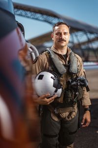 Student LTJG Spenser Neel posing next to a T-45. (Credit: National Geographic/Freddie Claire)