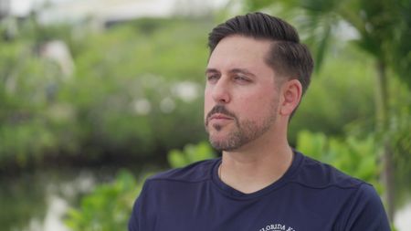Jameson Reeder Sr being interviewed and recalling the story of witnessing his son, Jameson Reeder Jr being attacked by a shark. (National Geographic)