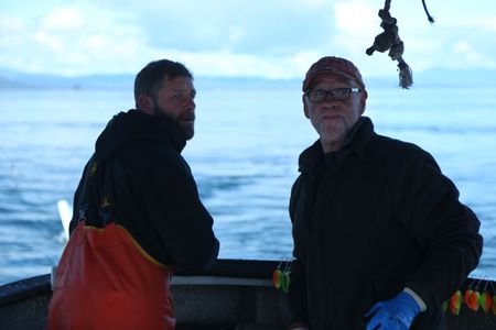 Matt Carlson and Sam Carlson fish for salmon near the end of the summer troll season. (National Geographic/Wayne Moss)