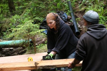 Veronica Arrants and Dave Palmer rebuild a dam in their community. (National Geographic/Wayne Moss)