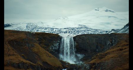 A glacial tongue behind a waterfall.   (credit: National Geographic)