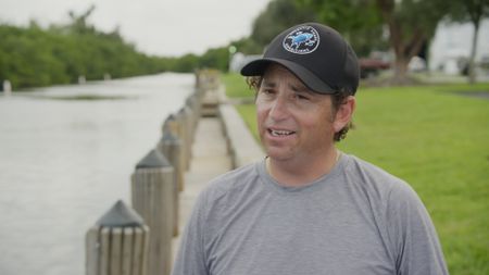 Dr. Neil Hammerschlag, shark researcher, discussing the behavior of sharks and explaining their feeding habits. (National Geographic)