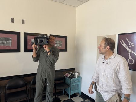 Student Captain Micah Nissly holds onto DOP Jon Southgate-Sayer's camera during filming. (Credit: National Geographic/Freddie Claire)