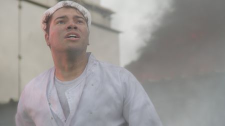 George Bland (played by Daniel Abbott) tries to evacuate the USS West Virginia while under attack in a WW2 historic reenactment scene for "Erased: WW2's Heroes of Color. The series tells the stories of three Black heroes who miraculously survived the attack on Pearl Harbor. One of these men is George Bland, who served as mess attendant on the USS West Virginia. (National Geographic)