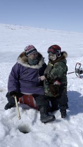 Teresa Pingayak ice fishing. (National Geographic/Matt Kynoch)