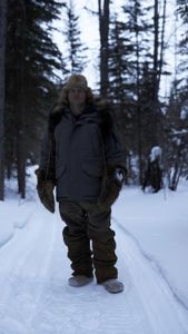 Jamey Joseph setting marten traps in the woods. (National Geographic/Ashton Hurlburt)