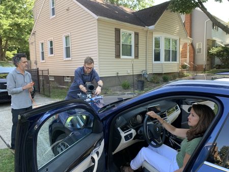 DNA Doe Project volunteer Traci Onders and the film crew prepare to film a driving scene.(National Geographic/Louise Haines)