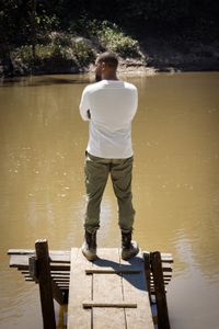 Will Smith looks out over the water during his visit to the Ecuadorian rainforest where they went looking for an anaconda. (credit: National Geographic/Kyle Christy)
