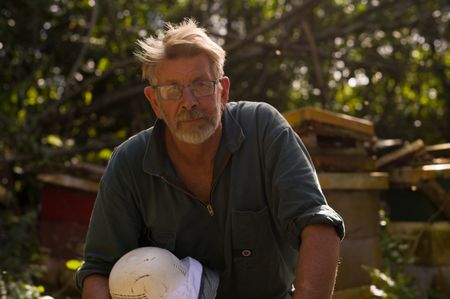 Andy Cory, the Niuean Honey Man, poses for a portrait. The island's isolation has protected bees from disease and parasites. The bees play an important role in biodiversity in Niue. (National Geographic/James Peterson)