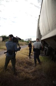 Mariana van Zeller and film crew stand around trains in Culiacán, Mexico. (National Geographic)