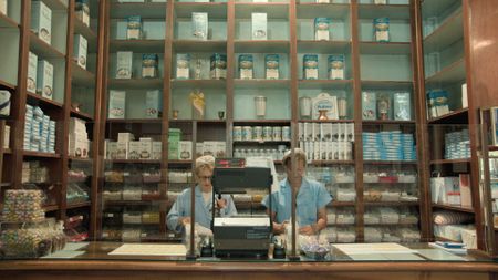 The Pelino shop interior, featuring two shop assistants in full attire, with confetti boxes in the background.  (credit: National Geographic)