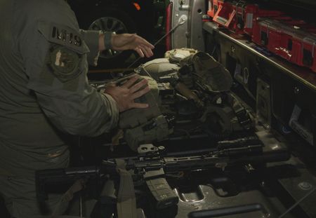 An HSI Agent in the artillery room goes through weapons and supplies in Fajardo, P.R. (Lucky 8 TV/Ivan Leon)