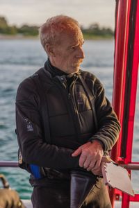 Director and cinematographer, Adam Geiger, on board a dive vessel in Port Phillip Bay.  (photo credit: National Geographic/Harriet Spark)