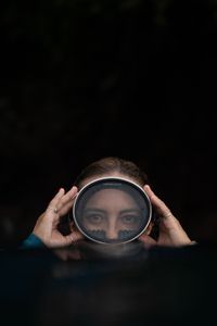 Dr Alex Schnell adjusts her dive mask on the surface while snorkeling in Lembeh Strait.  (National Geographic for Disney/Craig Parry)