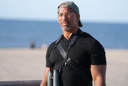 Christian Cooper surveys the beach at Fort Tilden. (National Geographic/Troy Christopher)