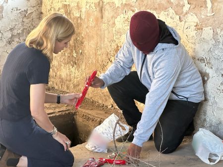 Mariana van Zeller looks at heist explosives with Super. (National Geographic)