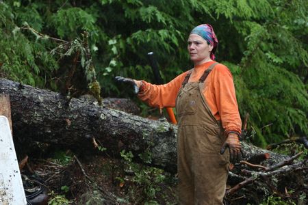 Veronica Arrants clears threatening trees from her property. (National Geographic/Wayne Moss)
