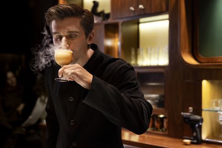 Antoni Porowski tastes the Custard Bun mocktail at Double Chicken Please. (National Geographic/Jose Alvarado Jr.)